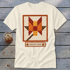 Cream t-shirt featuring a quilted maple leaf design and "MAPLE LEAF" text.
