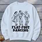 White sweatshirt with black line art of three people flat-foot dancing and text.