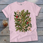 Pink t-shirt with botanical illustration of holly, pine branches, and berries.