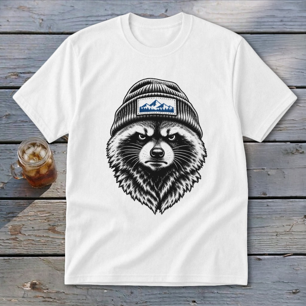 White t-shirt with a black and white illustration of a raccoon wearing a beanie with mountains.