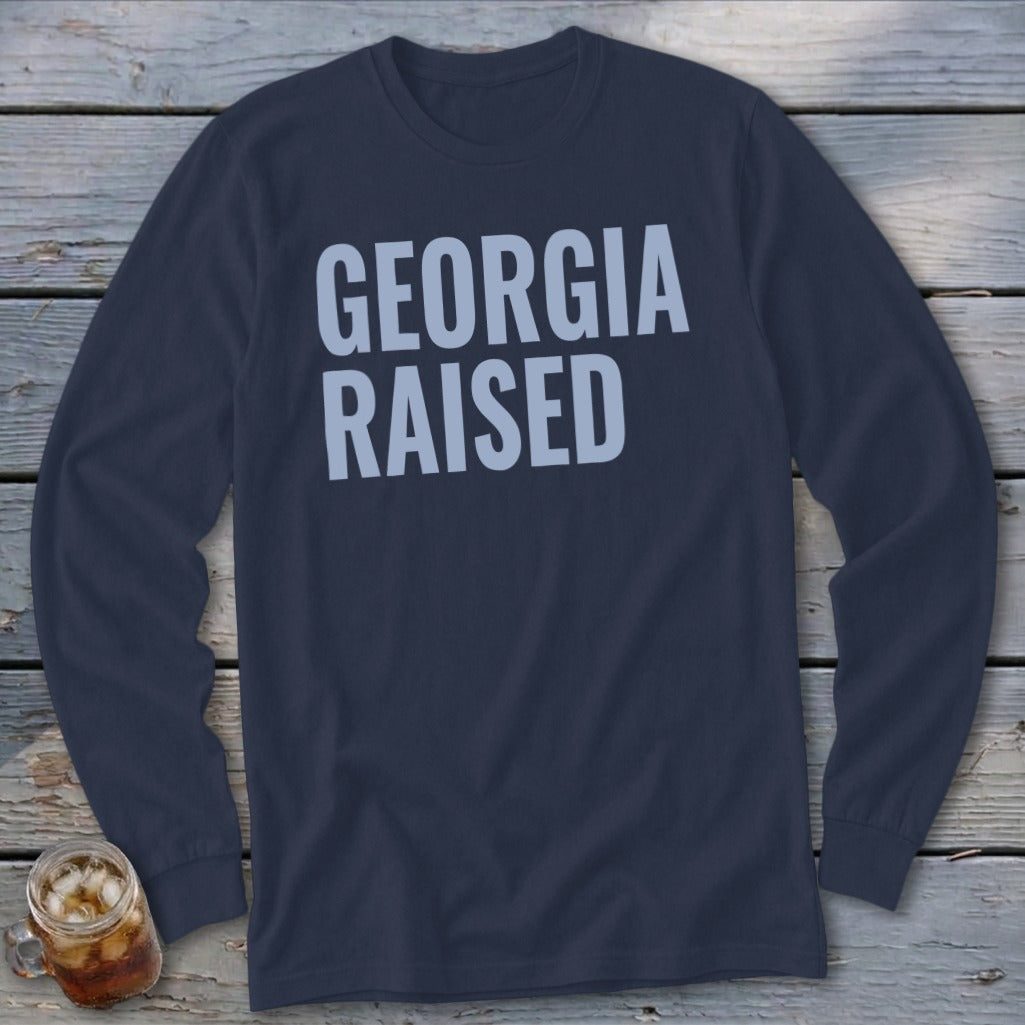 Long sleeve navy t-shirt with "GEORGIA RAISED" text in light blue.