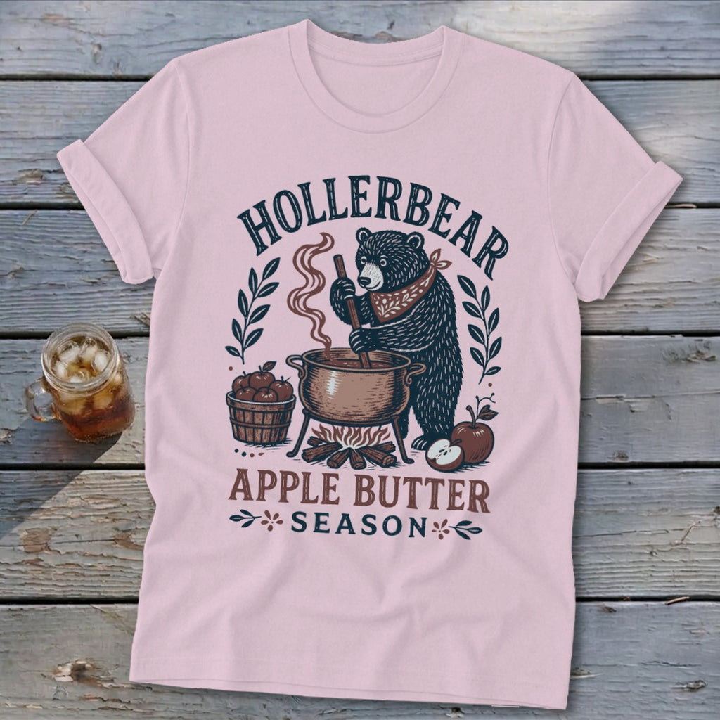 Bear stirring pot of apple butter with "Hollerbear Apple Butter Season" text.