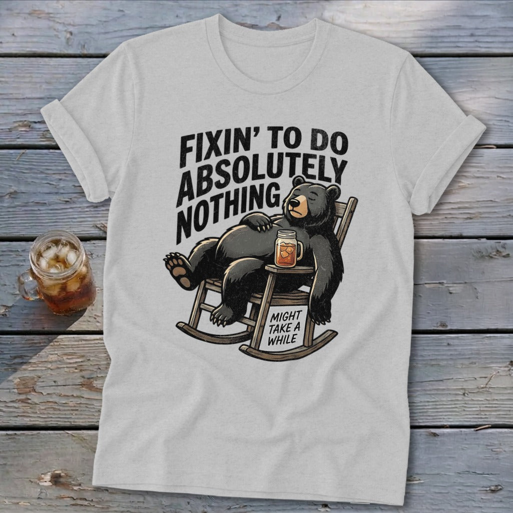 Light gray t-shirt with a graphic of a relaxed bear in a rocking chair and text.