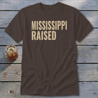Brown t-shirt with "MISSISSIPPI RAISED" text in beige.