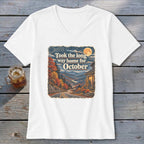 White v-neck t-shirt with fall landscape graphic and text "Took the long way home for October."
