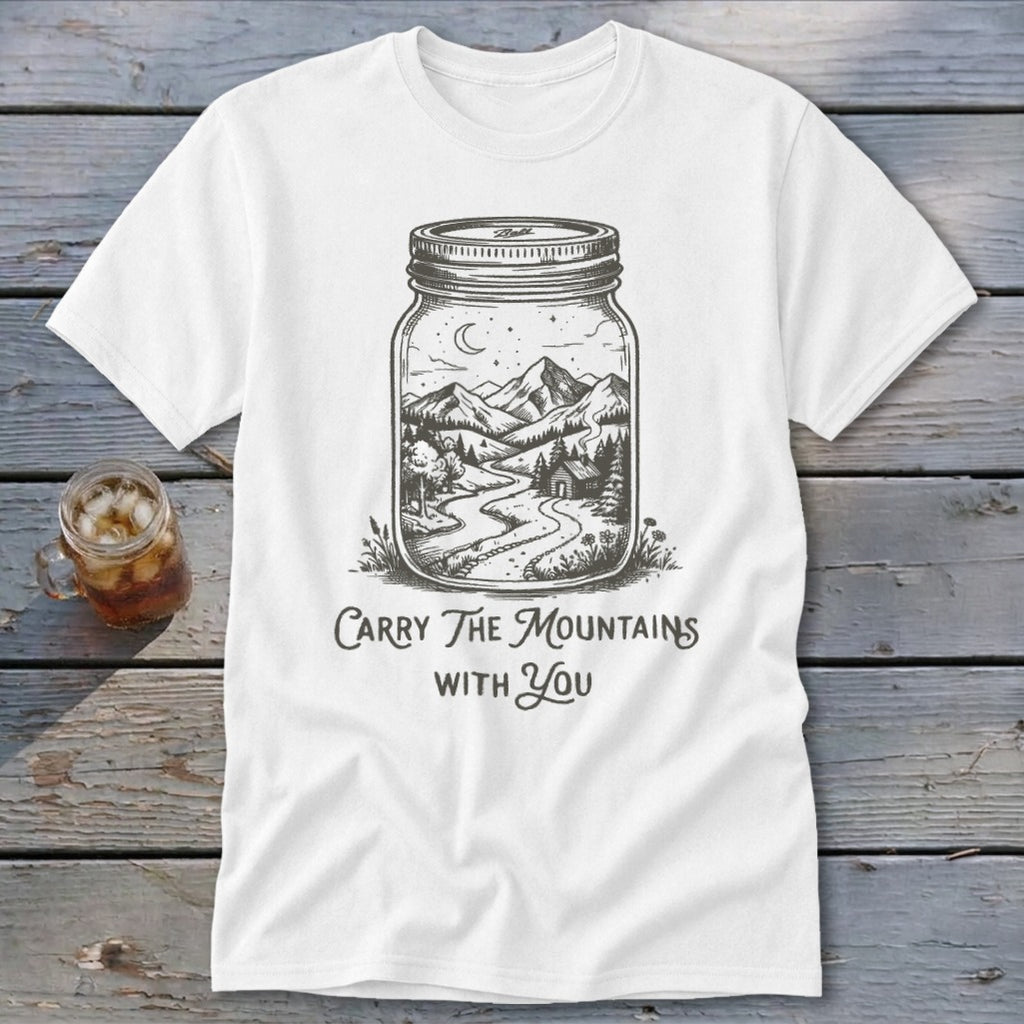 A white t-shirt featuring a mason jar illustration filled with a mountain landscape and text that reads Carry The Mountains With You.