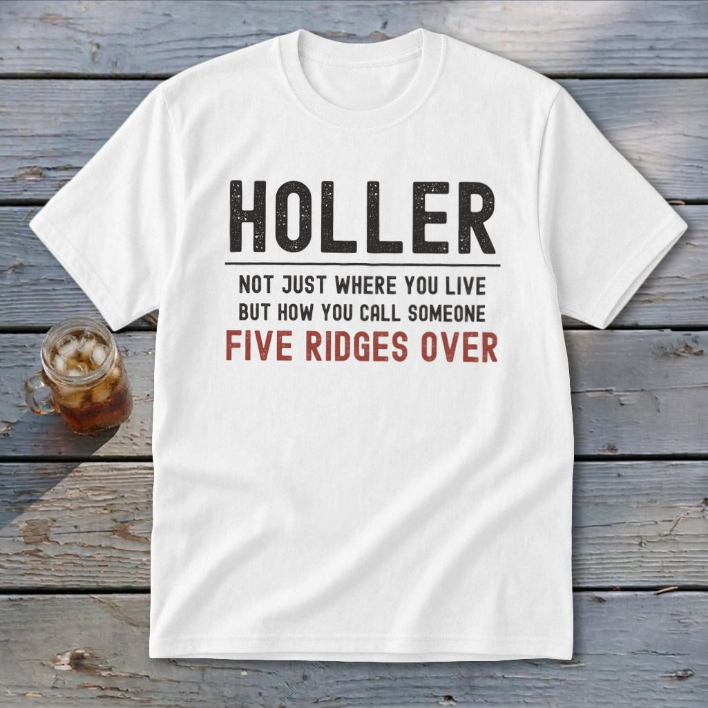 White t-shirt with black and red text reading "HOLLER NOT JUST WHERE YOU LIVE BUT HOW YOU CALL SOMEONE FIVE RIDGES OVER".