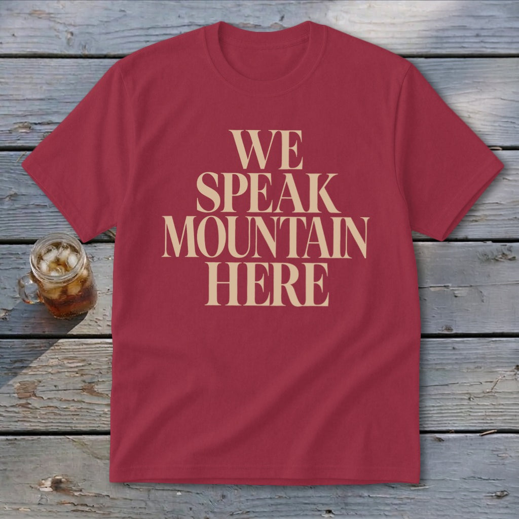 Maroon t-shirt with beige text reading "WE SPEAK MOUNTAIN HERE".