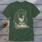 Bear wearing apron kneading dough on wooden board illustration on dark green t-shirt.