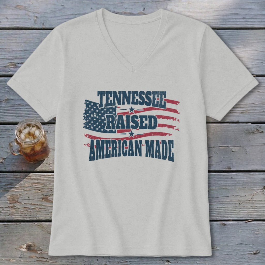 Light gray v-neck t-shirt with distressed "Tennessee Raised American Made" text and flag graphic.