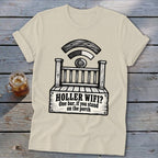 Beige t-shirt featuring a black graphic of a porch with a wifi signal and text reading HOLLER WIFI? One bar, if you stand on the porch.