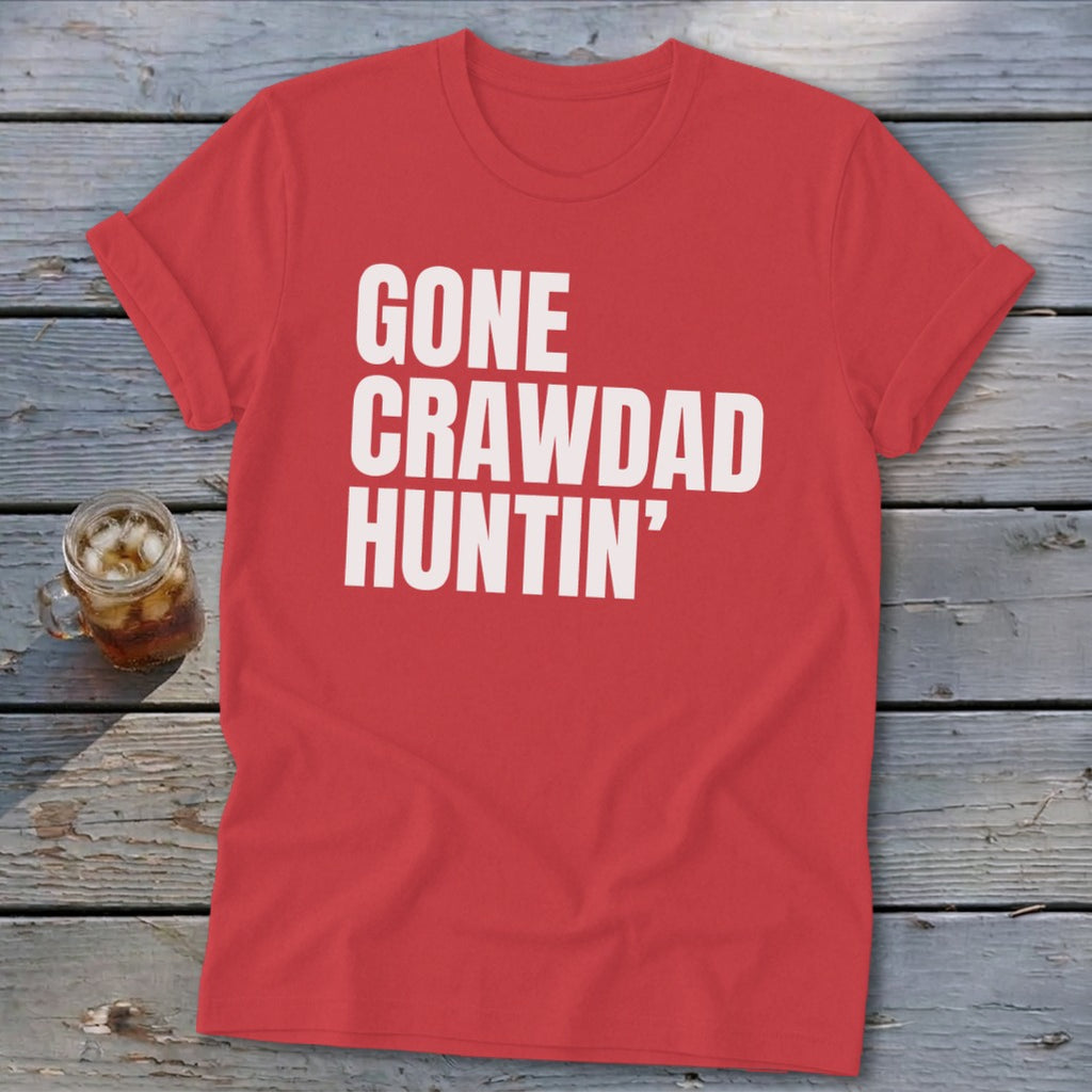 Red t-shirt with white text "GONE CRAWDAD HUNTIN'" and a drink.