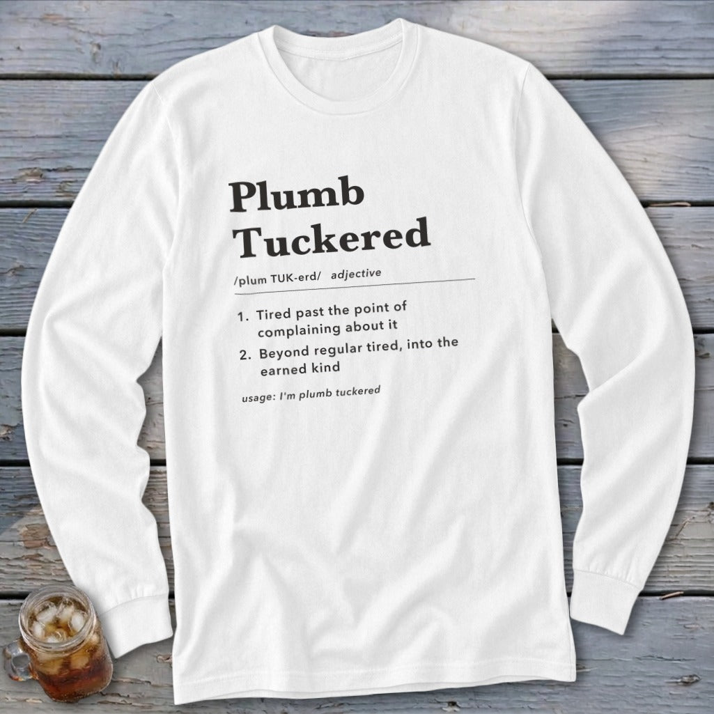 White long-sleeve shirt with "Plumb --- definition of plumb tuckered, adjective."