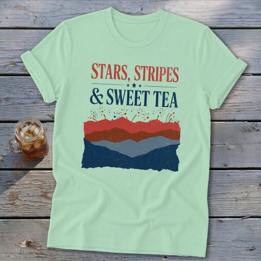 Light green t-shirt with red, white, and blue text reading Stars, Stripes & Sweet Tea.