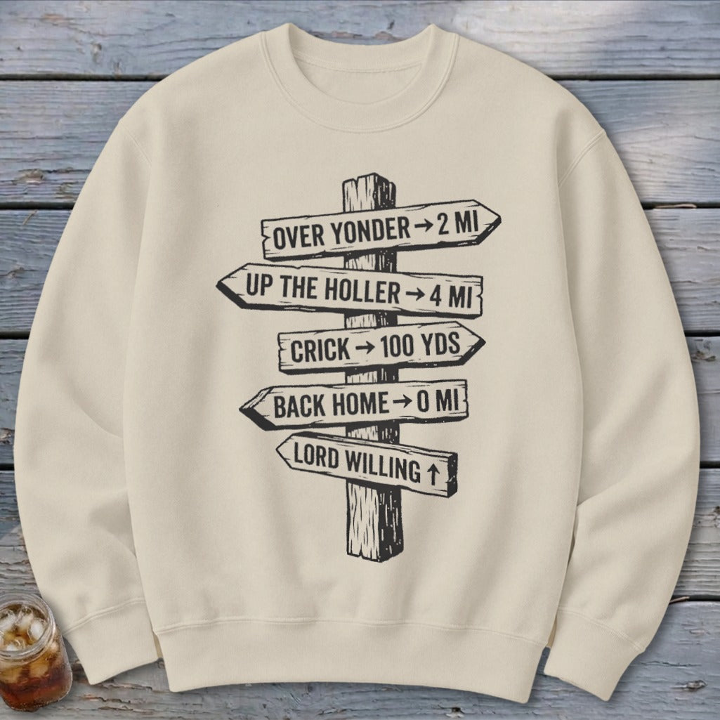 Beige crewneck sweatshirt featuring a black graphic of a wooden signpost with rustic directional distances.