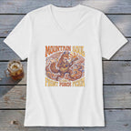 White v-neck t-shirt with a graphic of a fox playing guitar, "Mountain Soul," and "Front Porch Pickin'."