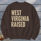 Brown sweatshirt with "WEST VIRGINIA RAISED" in cream text.