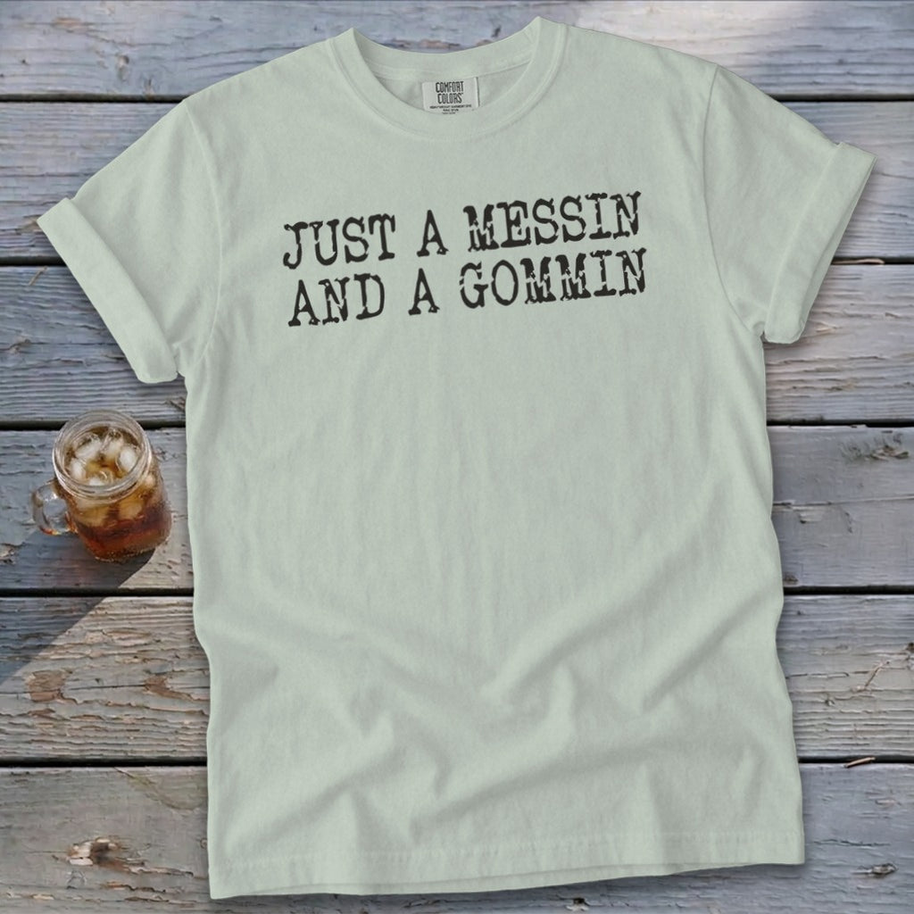 Light green t-shirt with black text "JUST A MESSIN AND A GOMMIN".