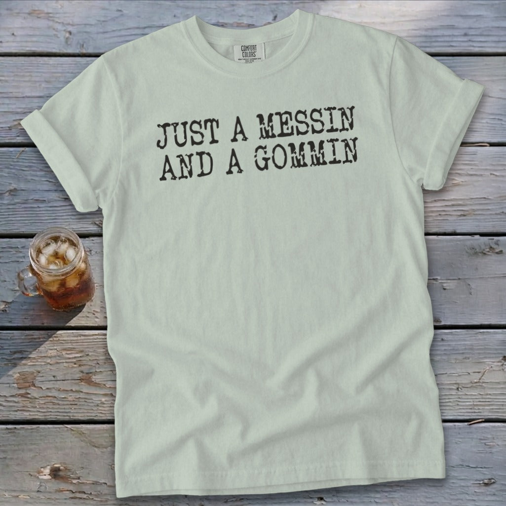 Light green t-shirt with black text "JUST A MESSIN AND A GOMMIN".