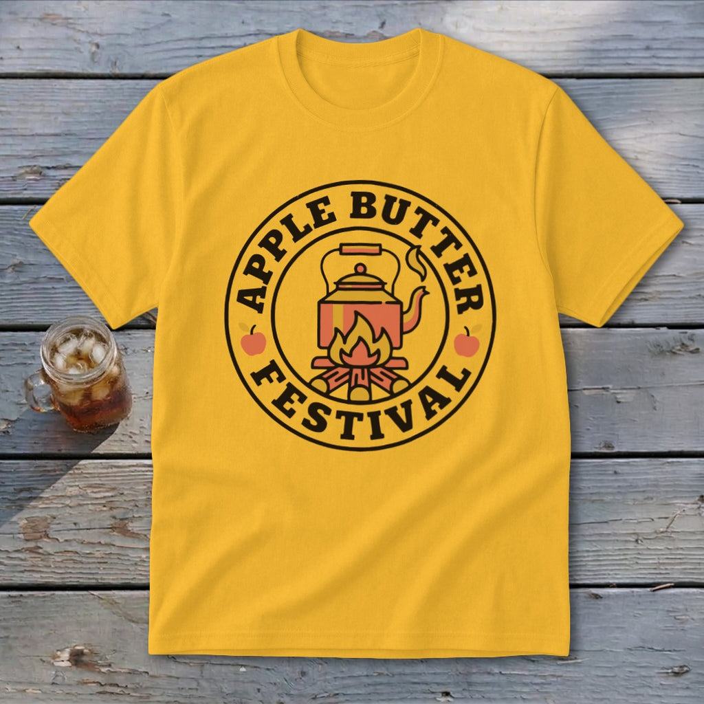 Yellow t-shirt with circular "Apple Butter Festival" graphic featuring a kettle over a campfire.