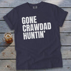 Navy t-shirt with white text that reads "GONE CRAWDAD HUNTIN'".