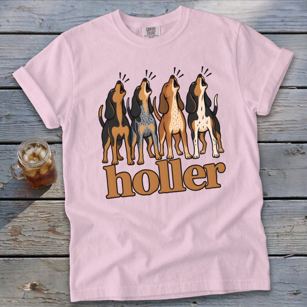 Pink t-shirt with four howling dogs and "holler" text.