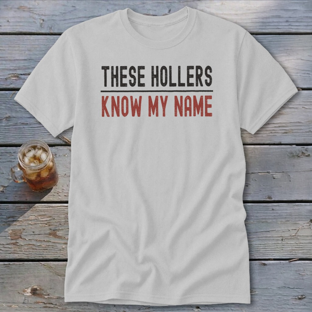 White t-shirt with distressed text "THESE HOLLERS KNOW MY NAME."