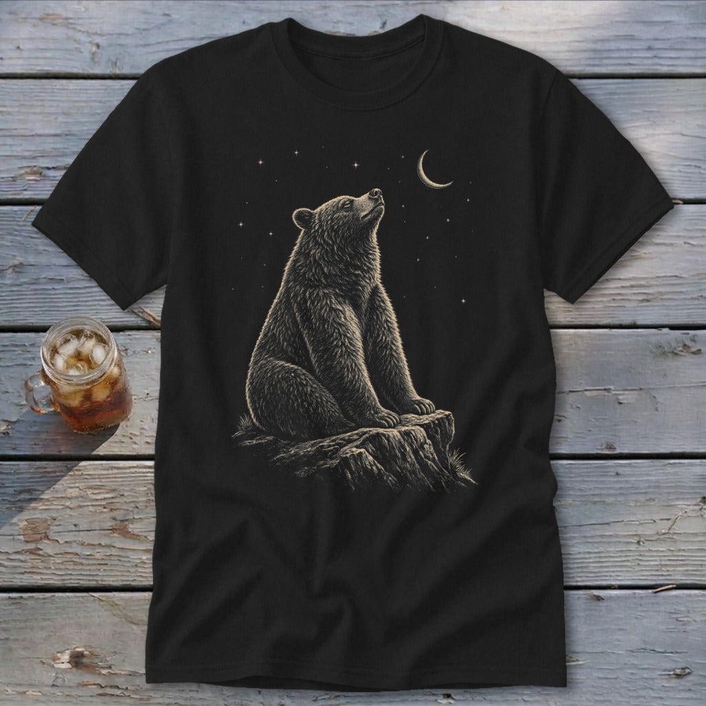 Black t-shirt with a bear sitting on a rock looking at the moon and stars.