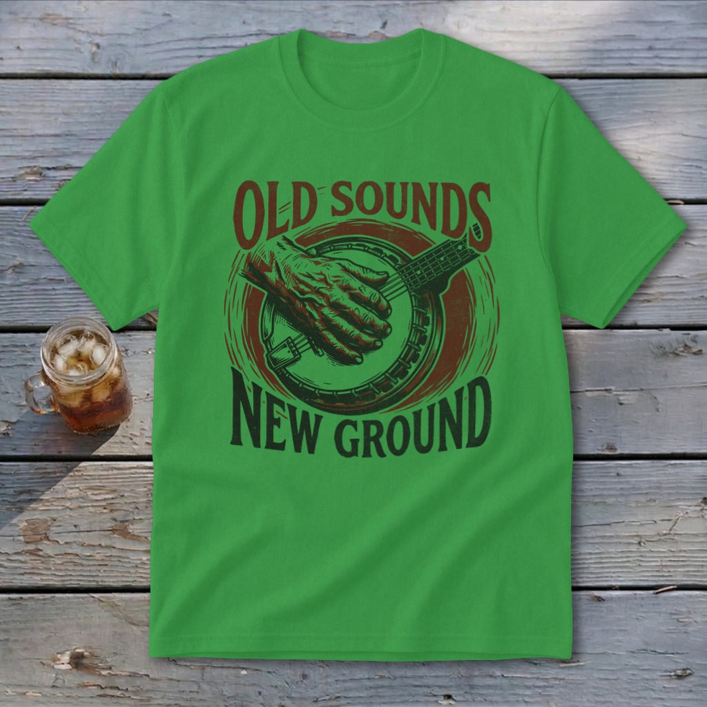 A green crewneck t-shirt featuring a banjo design and text that reads Old Sounds New Ground.