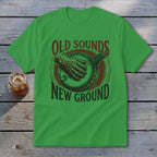 A green crewneck t-shirt featuring a banjo design and text that reads Old Sounds New Ground.