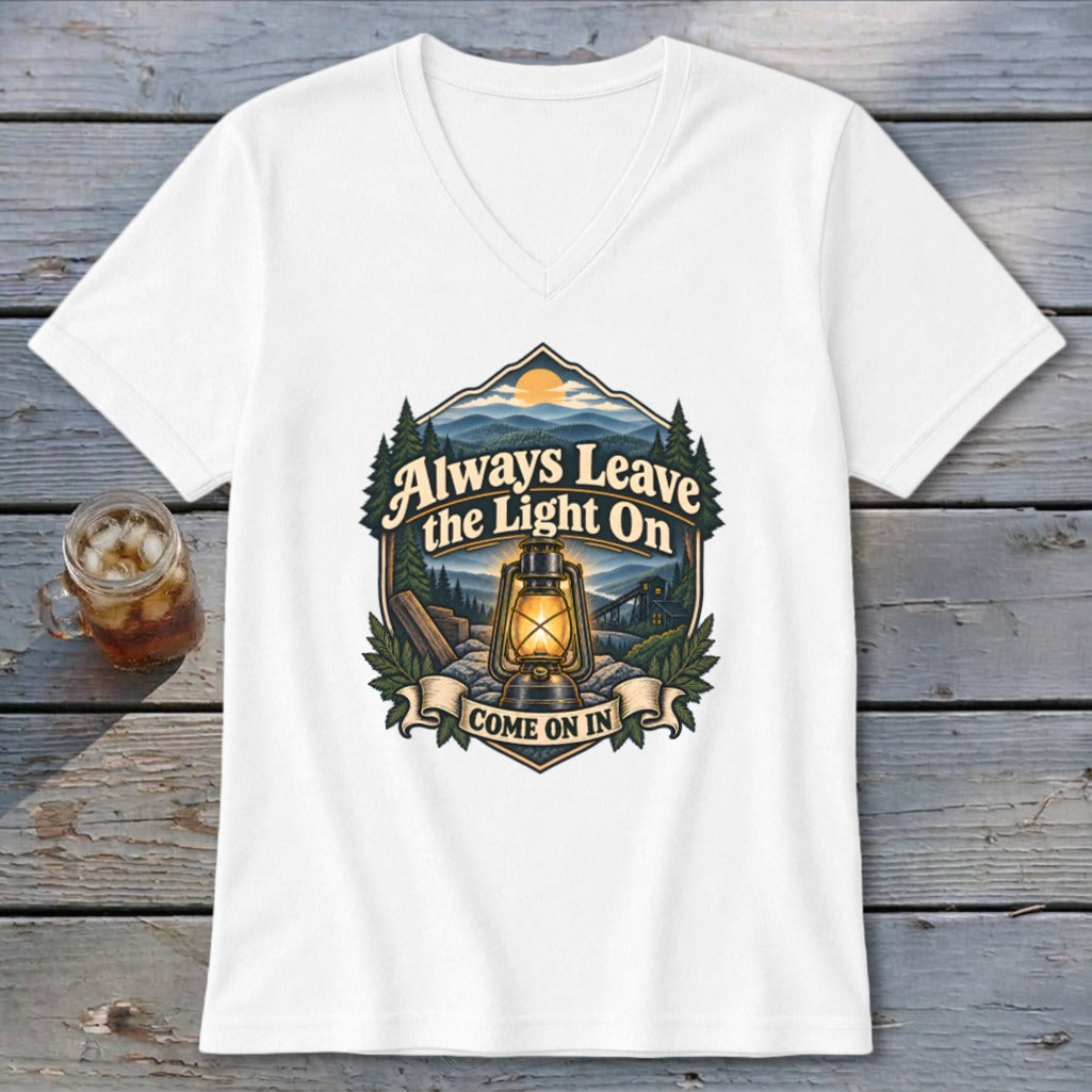 White v-neck t-shirt featuring a lantern and the text "Always Leave the Light On, Come On In."