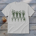 Light grey t-shirt featuring a green graphic of four mason jars filled with wildflowers on a shelf.