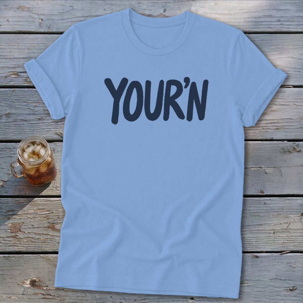 Light blue t-shirt with "YOUR'N" printed in dark blue.