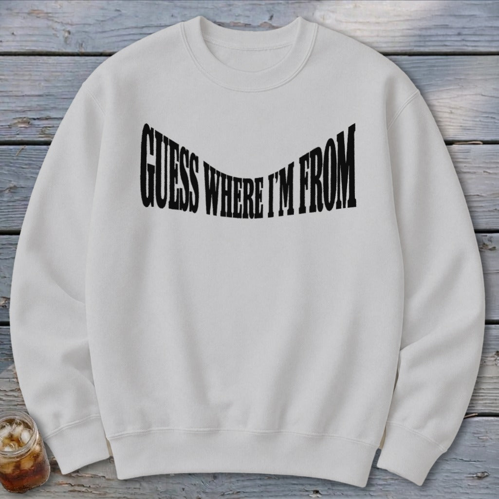 White crewneck sweatshirt with black text "GUESS WHERE I'M FROM" across chest.