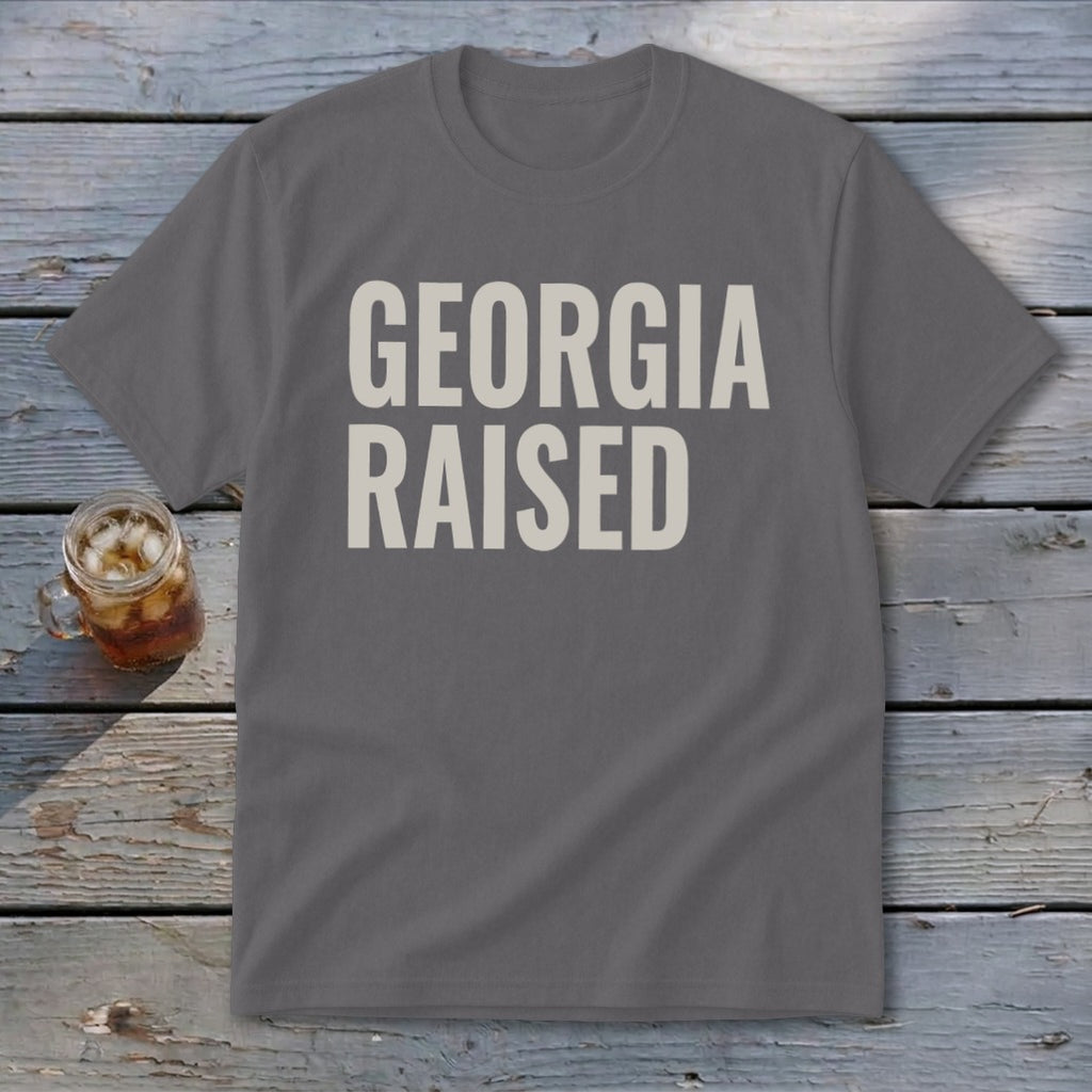 Gray t-shirt with "GEORGIA RAISED" in beige text.