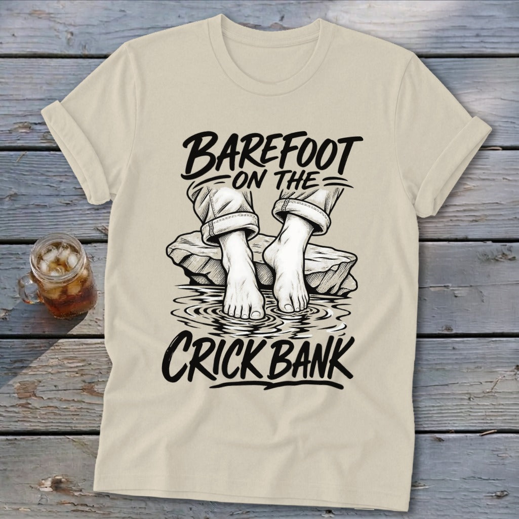 T-shirt graphic: Barefoot on the Crick Bank with bare feet on rocks in water.