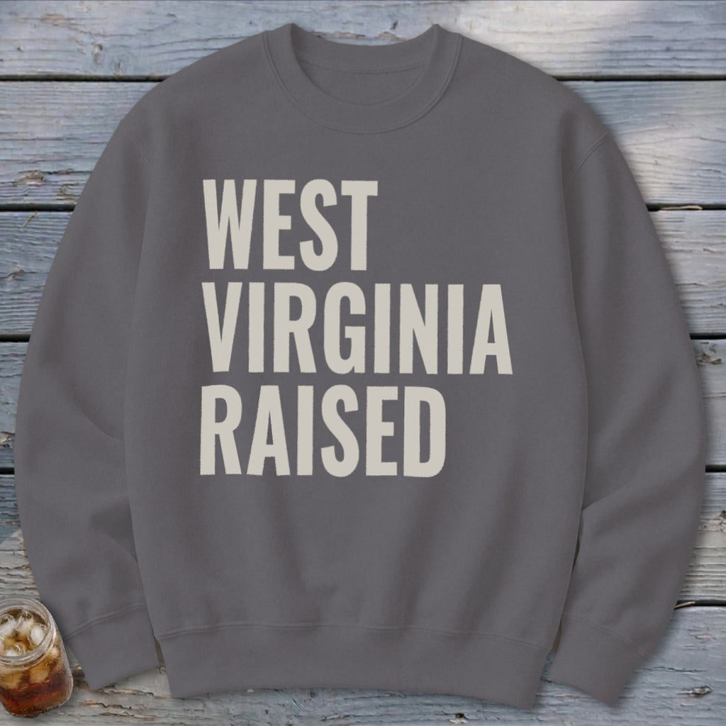 Gray sweatshirt with "WEST VIRGINIA RAISED" text in cream.