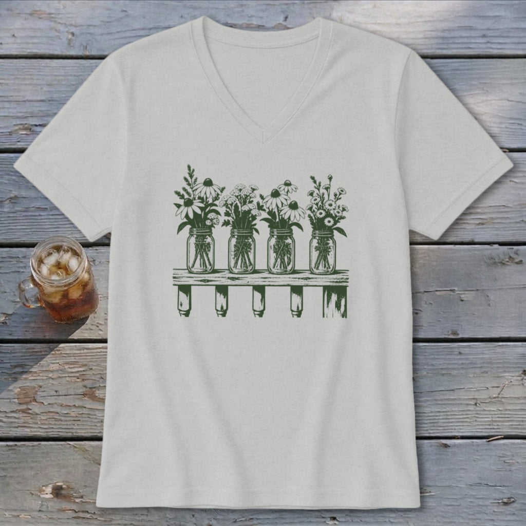 A light gray V-neck t-shirt featuring a green graphic of four mason jars filled with wildflowers on a shelf.