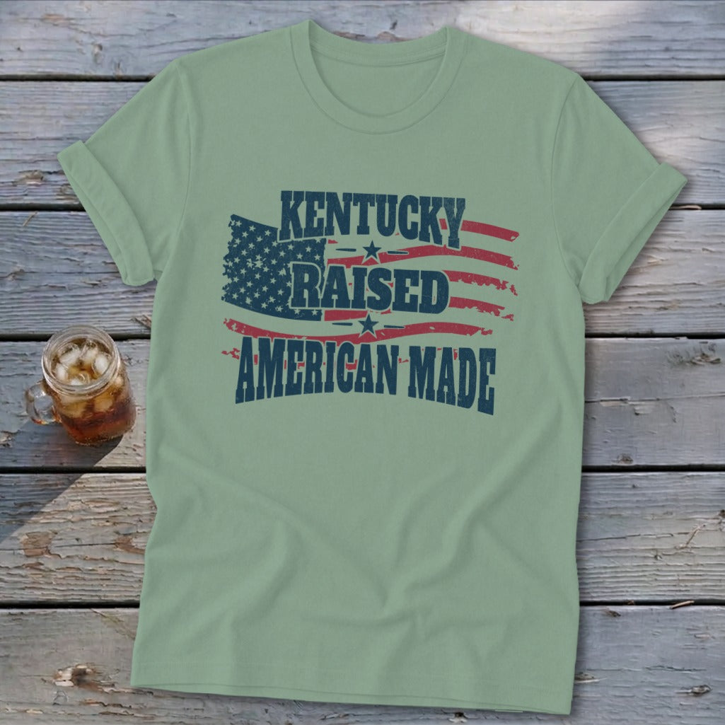 T-shirt with "Kentucky Raised American Made" text and distressed US flag graphic.