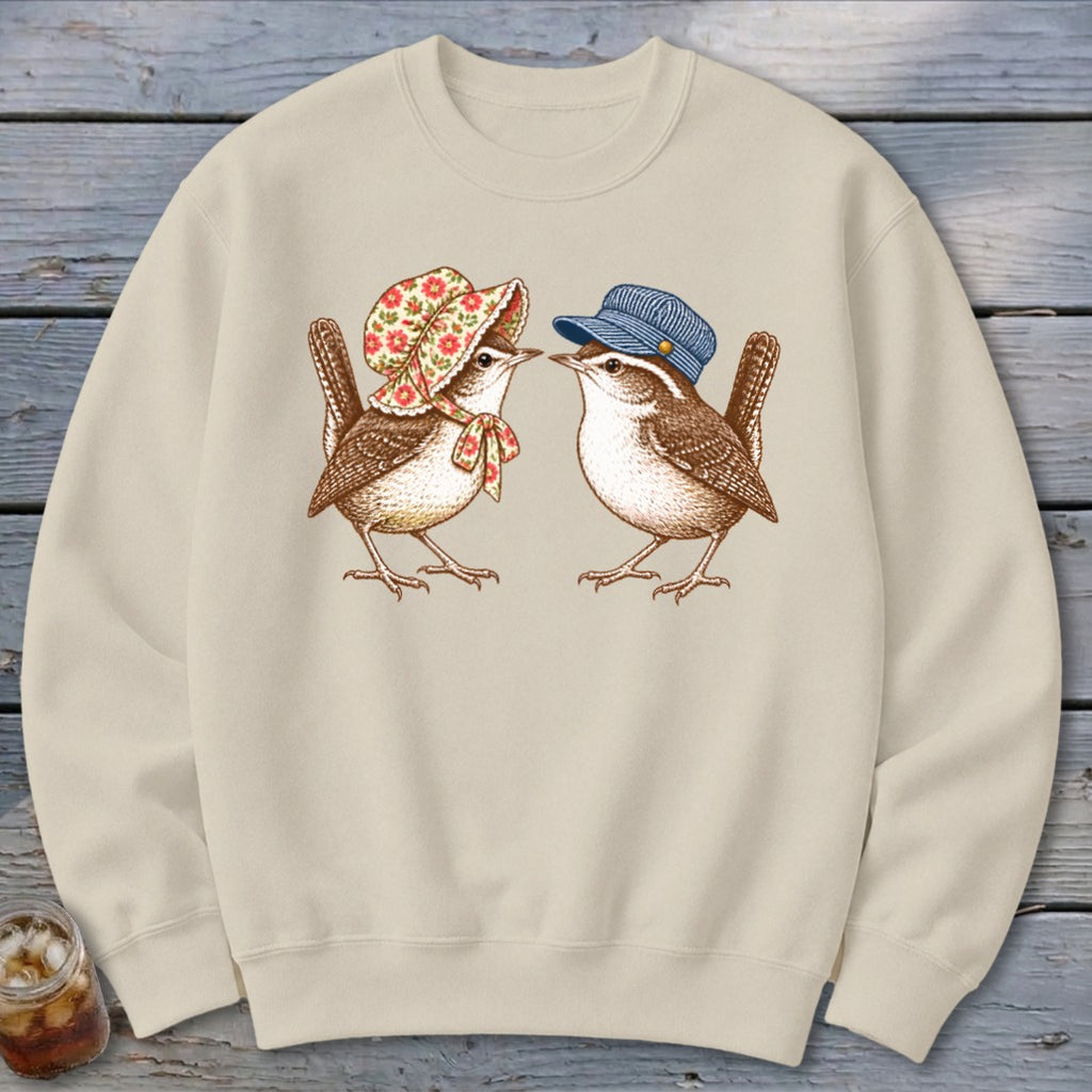 Two birds, one wearing a bonnet, the other a cap, facing each other.
