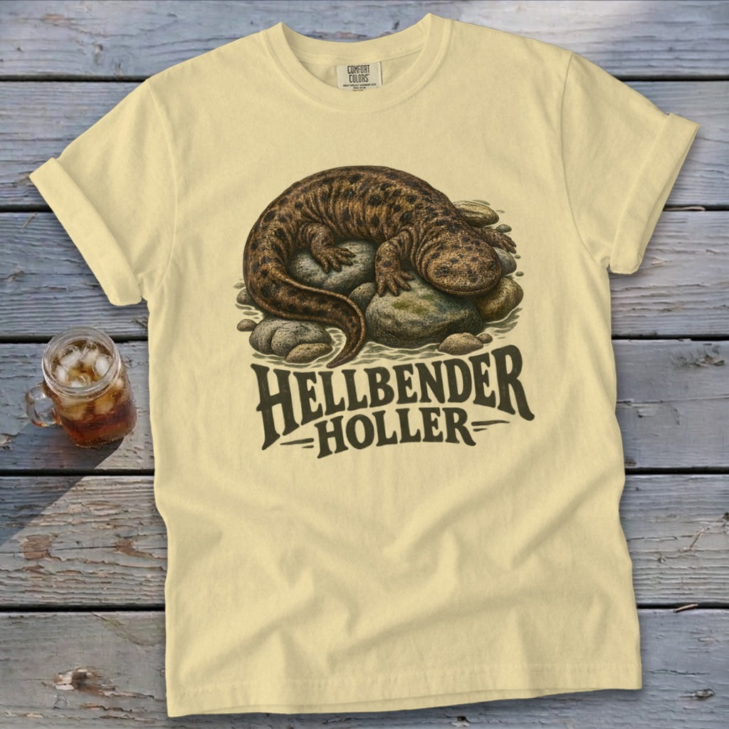 Hellbender salamander on rocks with "Hellbender Holler" text on a light yellow t-shirt.
