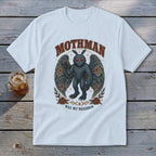 White t-shirt featuring Mothman graphic with text "Mothman Was My Neighbor".