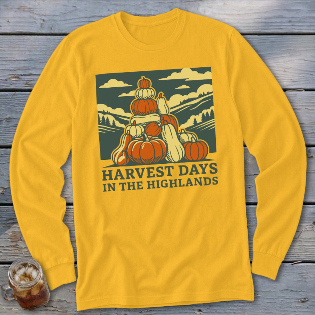 Yellow long-sleeve t-shirt featuring a graphic of a pumpkin stack with text that reads Harvest Days in the Highlands.