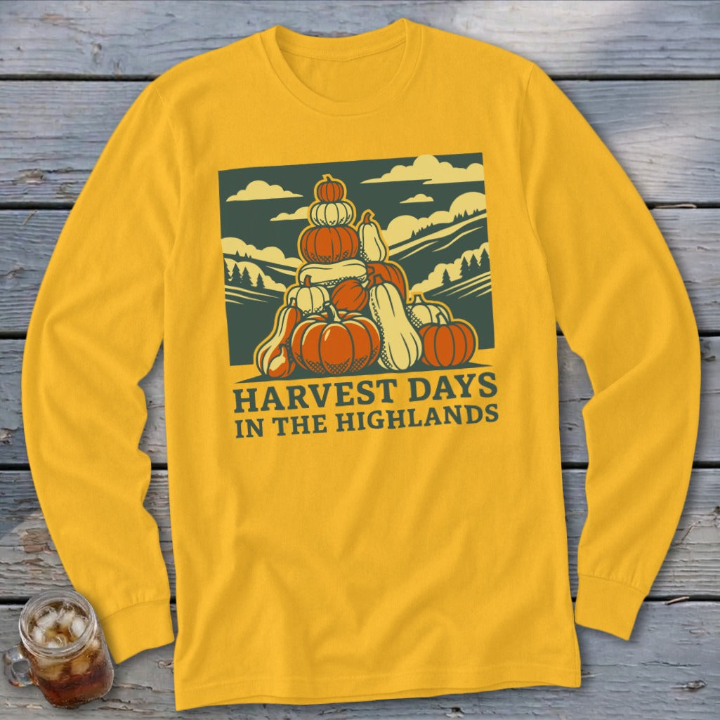 Yellow long-sleeve t-shirt featuring a graphic of a pumpkin stack with text that reads Harvest Days in the Highlands.
