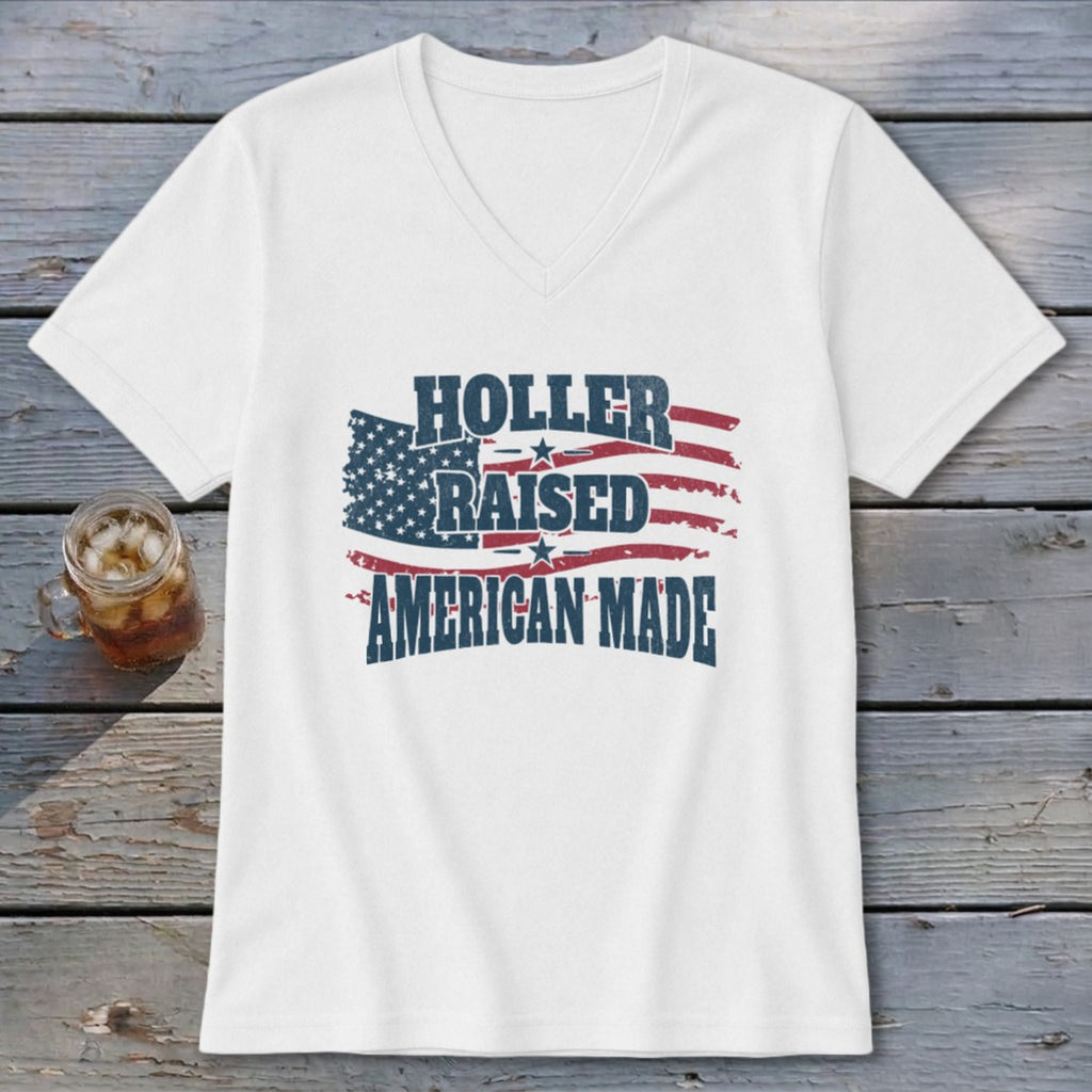 White v-neck t-shirt with distressed American flag graphic and text.
