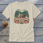 T-shirt with "Homebound for the Mountain Christmas" text and vintage winter scene.