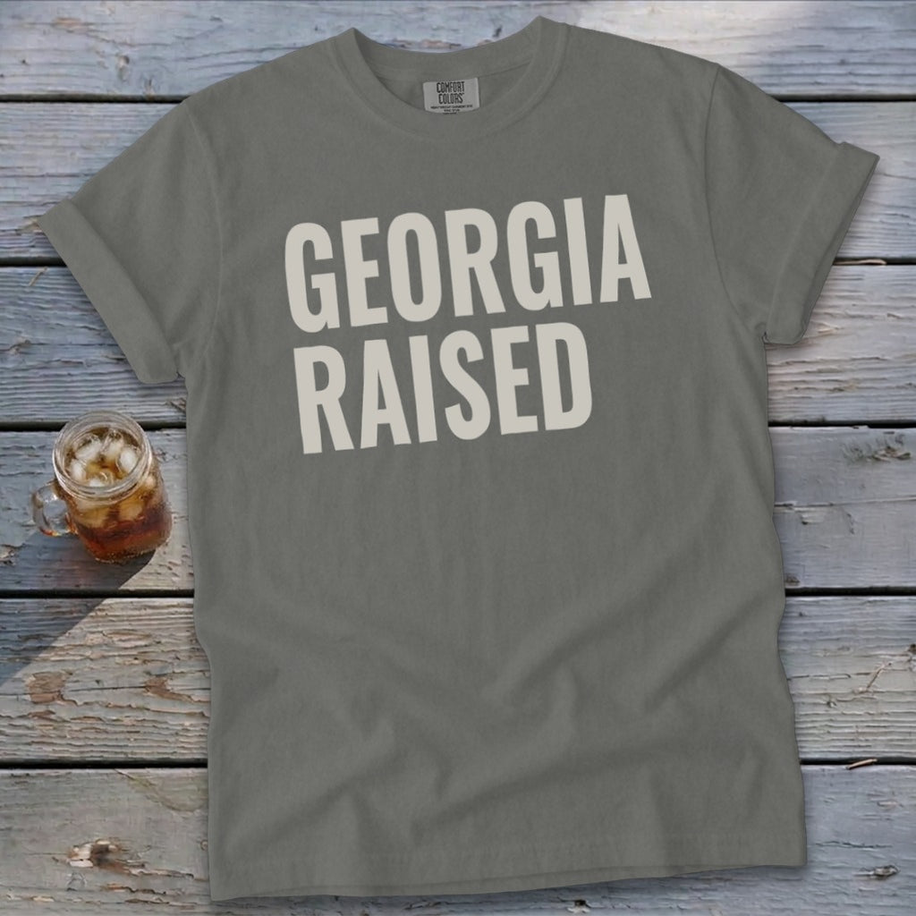 Gray t-shirt with "GEORGIA RAISED" printed in white text.