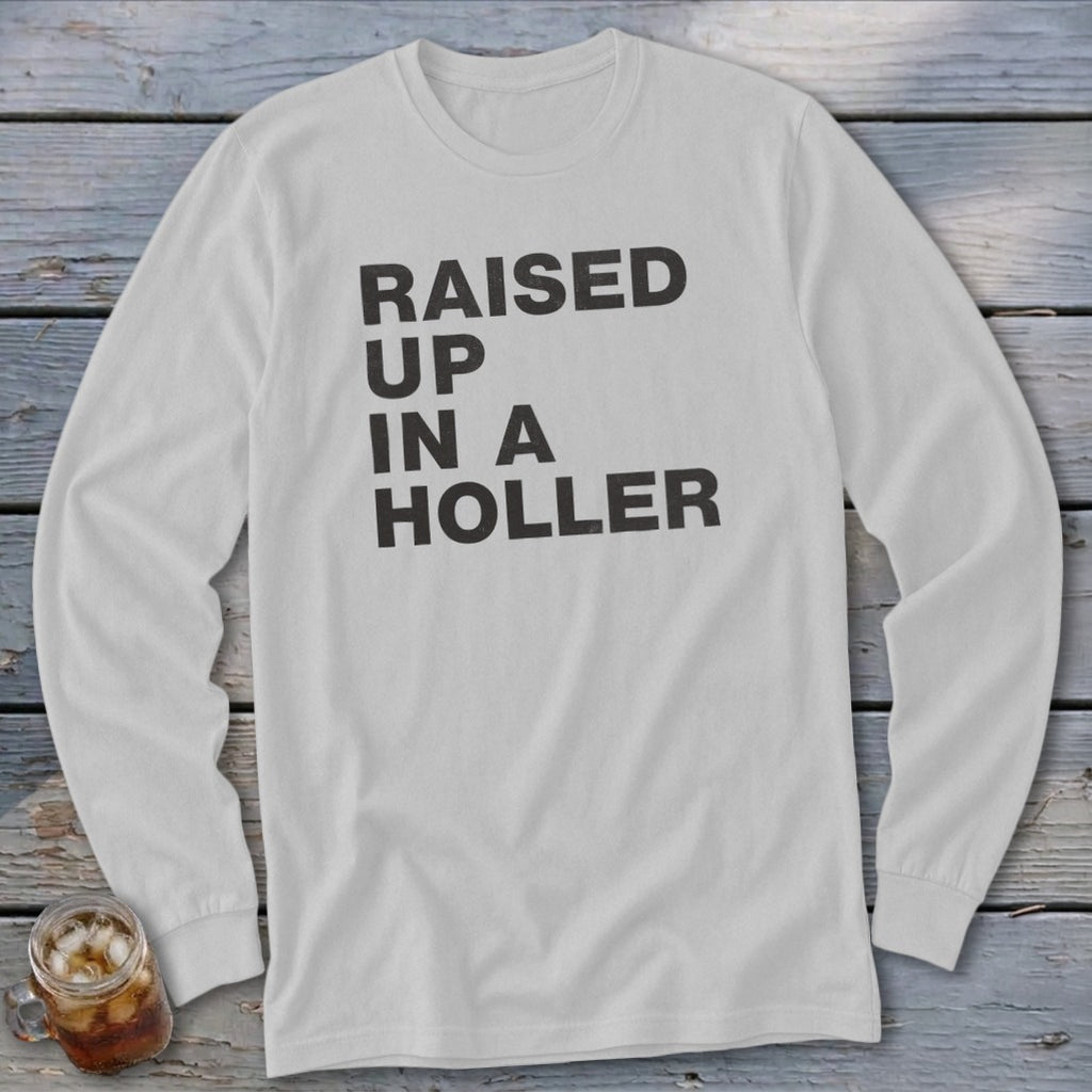 White long-sleeve shirt with "RAISED UP IN A HOLLER" text.
