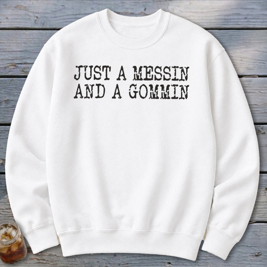 White sweatshirt with black text reading "JUST A MESSIN AND A GOMMIN".