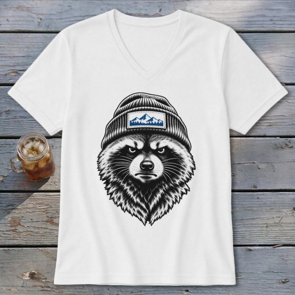 White v-neck t-shirt with a raccoon wearing a beanie and a mountain patch.